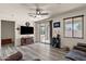 Bright living room with ceiling fan, wood flooring, and sliding glass door at 3326 N 31St St, Mesa, AZ 85213