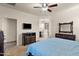 Spacious bedroom showcasing carpeted floors, modern furniture, and an adjacent bathroom at 3326 N 31St St, Mesa, AZ 85213