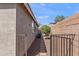 Narrow side yard with pavers, small gate, and block wall at 3326 N 31St St, Mesa, AZ 85213