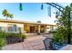 Inviting back patio with comfortable seating, string lights, and a covered area for outdoor dining and entertaining at 4046 E Crocus Dr, Phoenix, AZ 85032