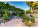 Expansive backyard area with plants, furniture, and mature trees at 4046 E Crocus Dr, Phoenix, AZ 85032