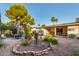 Picturesque backyard with lush greenery, mature trees, and comfortable seating area at 4046 E Crocus Dr, Phoenix, AZ 85032