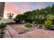 Beautiful backyard showcasing well-maintained landscaping, including trees and plants at 4046 E Crocus Dr, Phoenix, AZ 85032