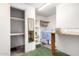 Unfinished basement featuring storage shelves, counter space, and a mirror at 4046 E Crocus Dr, Phoenix, AZ 85032