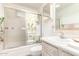 Bright bathroom showcasing vanity with marble countertop, toilet, and glass-enclosed shower at 4046 E Crocus Dr, Phoenix, AZ 85032