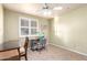 Bedroom with tile floors, window, and ceiling fan at 4046 E Crocus Dr, Phoenix, AZ 85032