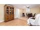 Dining area featuring wood floors, modern table set, and a large display cabinet at 4046 E Crocus Dr, Phoenix, AZ 85032