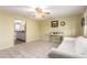 Bright living area features tile floors, ceiling fan, and open layout to kitchen at 4046 E Crocus Dr, Phoenix, AZ 85032