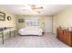 Bright living room with tile flooring, a ceiling fan, and natural light at 4046 E Crocus Dr, Phoenix, AZ 85032