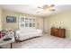 Bright living room with tile flooring, a ceiling fan, and natural light at 4046 E Crocus Dr, Phoenix, AZ 85032