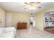 Open living area with tile floors, ceiling fan, and access to other rooms at 4046 E Crocus Dr, Phoenix, AZ 85032