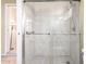 Bathroom shower features marble tile and grab bars at 4046 E Crocus Dr, Phoenix, AZ 85032