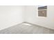 Empty bedroom with light gray carpet and window providing natural light at 4195 W Lisa Ln, San Tan Valley, AZ 85144