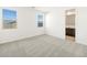Bright bedroom with two windows and an attached bathroom, offering a private and spacious retreat at 4195 W Lisa Ln, San Tan Valley, AZ 85144