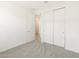 Bright bedroom with sliding closet doors and an open ensuite bathroom door at 4195 W Lisa Ln, San Tan Valley, AZ 85144