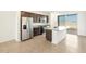 Open kitchen featuring stainless steel appliances, dark wood cabinetry, and granite countertops at 4195 W Lisa Ln, San Tan Valley, AZ 85144