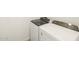 Modern, white Whirlpool washing machine and dryer set in a laundry area at 4195 W Lisa Ln, San Tan Valley, AZ 85144