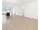 Open-concept living room boasting neutral tile flooring and bright, airy ambiance at 4195 W Lisa Ln, San Tan Valley, AZ 85144