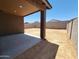 Covered patio offers a shaded outdoor space overlooking the spacious dirt backyard at 4195 W Lisa Ln, San Tan Valley, AZ 85144