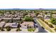 An aerial view of a cozy neighborhood, showcasing the mature landscaping and mountain views at 4530 E Decatur St, Mesa, AZ 85205