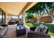 Relaxing back patio with comfortable seating and outdoor hot tub at 4530 E Decatur St, Mesa, AZ 85205