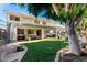 Expansive backyard with lush lawn and covered patio, perfect for entertaining at 4530 E Decatur St, Mesa, AZ 85205