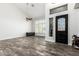 Bright entryway with decorative door, elegant tile floors, and ample natural light from the large window at 4530 E Decatur St, Mesa, AZ 85205