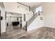Spacious foyer with beautiful flooring, staircase, and open view into the living room create an inviting ambiance at 4530 E Decatur St, Mesa, AZ 85205