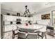 Bright kitchen featuring white cabinetry, a large island, modern appliances, and stylish decor at 4530 E Decatur St, Mesa, AZ 85205