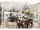 Well-appointed kitchen and dining area features a table, chandelier and slider to the outdoor living space at 4530 E Decatur St, Mesa, AZ 85205