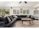 Inviting living room with large, comfortable sectional, perfect for relaxing or entertaining guests at 4530 E Decatur St, Mesa, AZ 85205