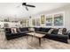 Open concept living room featuring lots of natural light and an adjacent kitchen-dining area for easy entertaining at 4530 E Decatur St, Mesa, AZ 85205