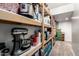 Organized pantry shelves provide ample storage space for kitchen appliances and pantry items at 4530 E Decatur St, Mesa, AZ 85205