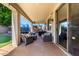 Covered patio with comfortable seating area, perfect for outdoor entertaining and relaxing in the backyard at 4530 E Decatur St, Mesa, AZ 85205
