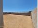 Fenced backyard with low-maintenance desert landscaping offering privacy at 4811 W Hunter Trl, San Tan Valley, AZ 85144