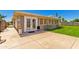 Covered back patio with brick accents, concrete flooring and a metal patio chair at 505 S Ridge --, Mesa, AZ 85204