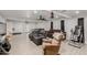 Finished basement featuring tile floors, ceiling fans, and ample seating areas at 505 S Ridge --, Mesa, AZ 85204