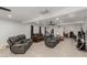 Finished basement featuring tile floors, ceiling fans, and ample seating areas at 505 S Ridge --, Mesa, AZ 85204