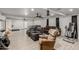 Finished basement with multiple seating areas, tile flooring, and a ceiling fan at 505 S Ridge --, Mesa, AZ 85204