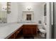 Traditional bathroom featuring a long vanity with wood cabinets and a tile floor at 505 S Ridge --, Mesa, AZ 85204