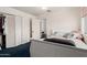 Comfortable bedroom features a bed, closet, carpeted floors, and a white door at 505 S Ridge --, Mesa, AZ 85204