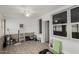 Bonus room with white ceiling fan, brick accents and tile floors provides a versatile space at 505 S Ridge --, Mesa, AZ 85204
