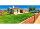 A single-Gathering home with a green lawn, brick perimeter and a blue truck in the driveway at 505 S Ridge --, Mesa, AZ 85204