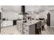 Bright kitchen featuring an island with granite countertops and seating for casual dining at 505 S Ridge --, Mesa, AZ 85204
