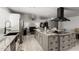 Open kitchen featuring a large island with granite countertops and a modern range hood at 505 S Ridge --, Mesa, AZ 85204