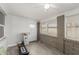 Bright sunroom with tiled floors, brick detail, lots of natural light, and a ceiling fan at 505 S Ridge --, Mesa, AZ 85204