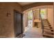 Entryway featuring front door leading to staircase with cautionary signage at 5401 E Van Buren St # 1088, Phoenix, AZ 85008