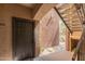 Entryway featuring front door adjacent to staircase with cautionary signage at 5401 E Van Buren St # 1088, Phoenix, AZ 85008