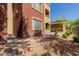 Exterior view of condo building showing stucco siding, well-maintained landscaping, and manicured bushes at 5401 E Van Buren St # 1088, Phoenix, AZ 85008