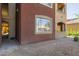 Condo exterior view featuring an enclosed patio with exterior window looking into the condo unit at 5401 E Van Buren St # 1088, Phoenix, AZ 85008